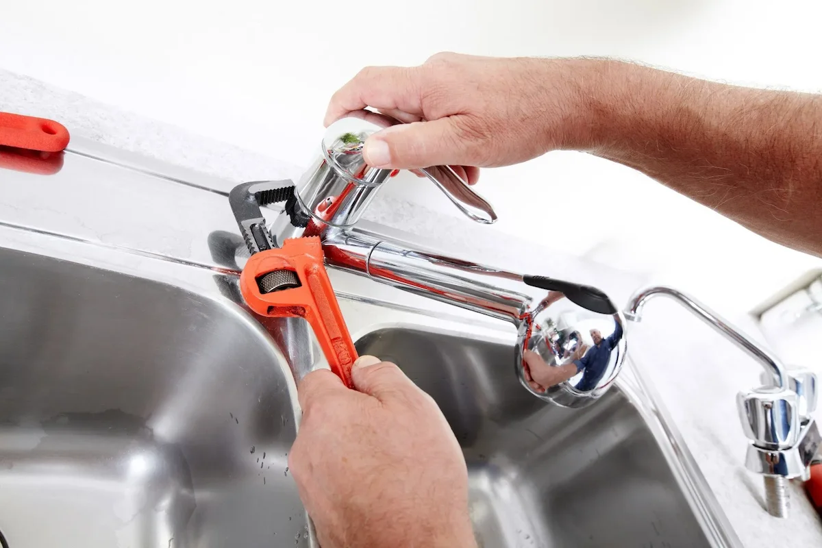 MPS plumber working on sink and tap plumbing in Croydon